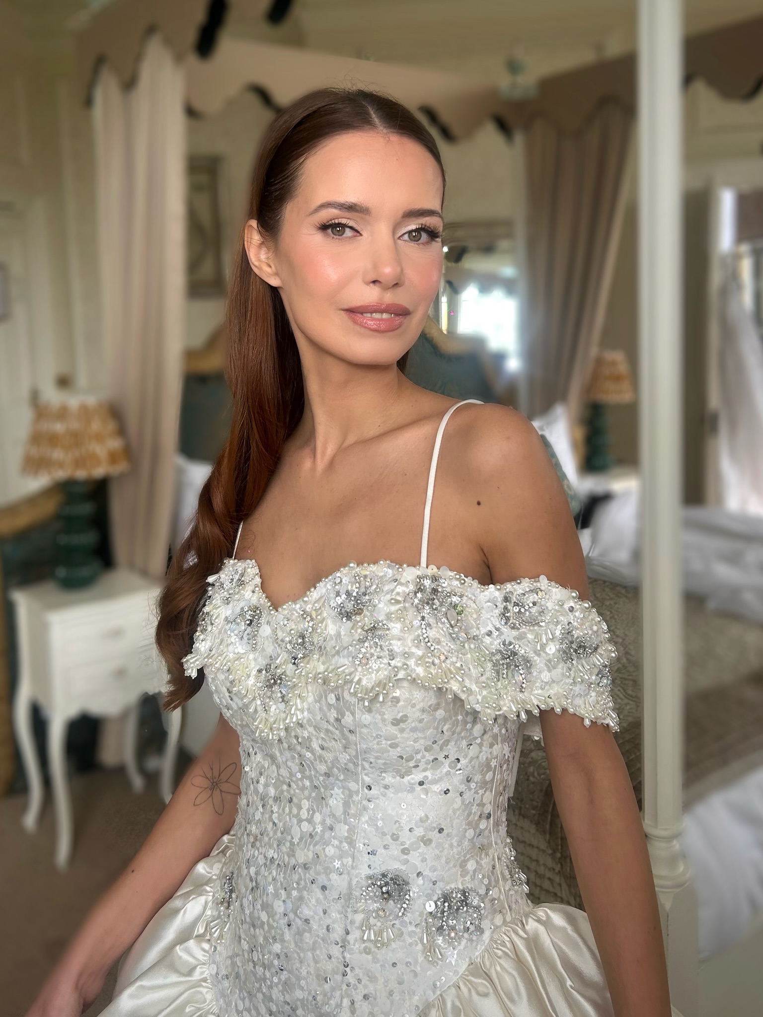 Stunning bride in embellished gown with flawless makeup