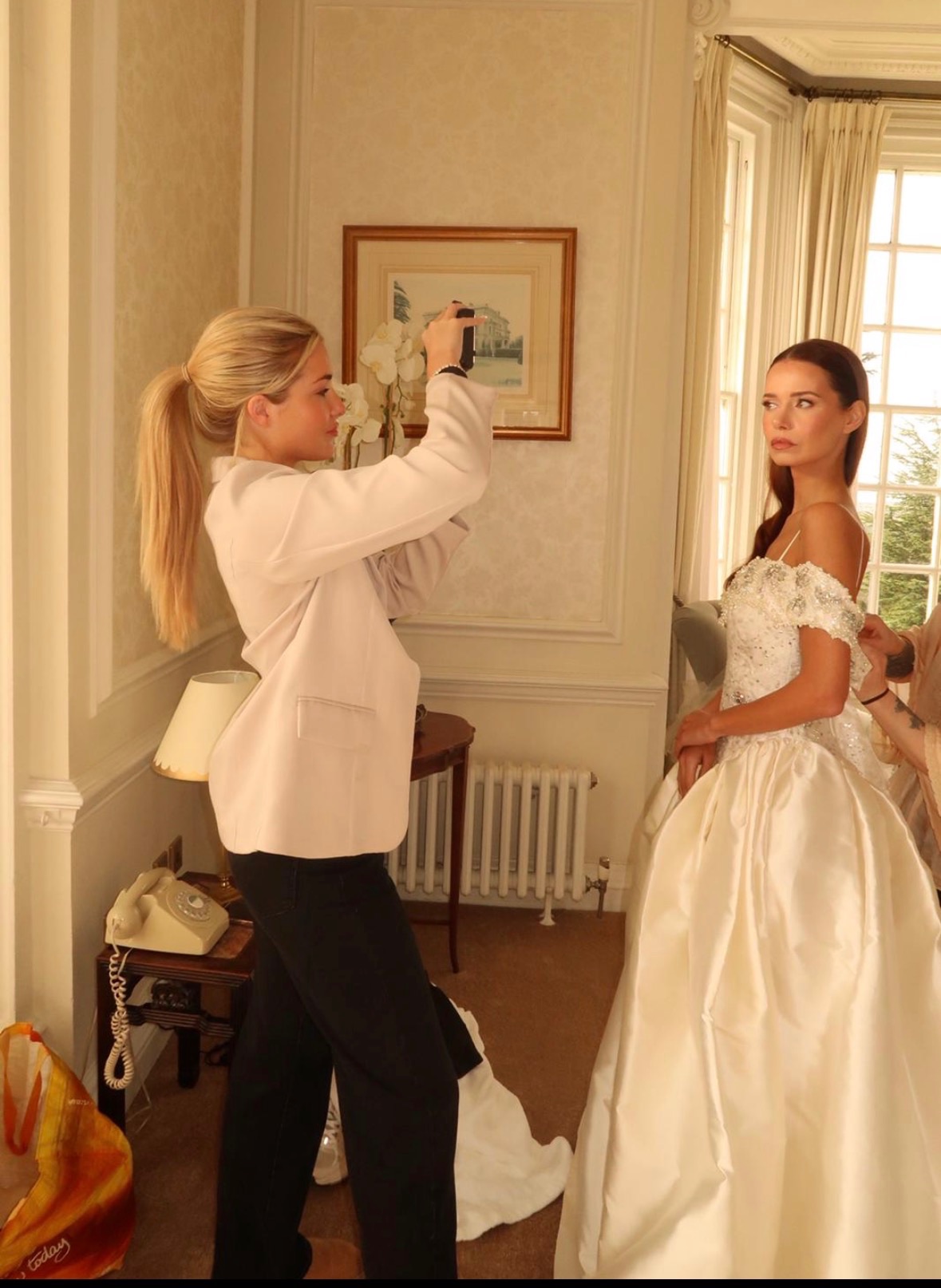 Behind the scenes bridal prep — bride in an embellished gown at a country house venue